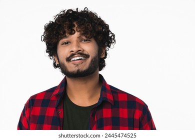 Closeup portrait of handsome young Hindi man with beard isolated over white background. Toothy smile of Indian boy in casual attire looking at camera - Powered by Shutterstock