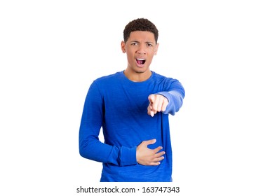 Closeup portrait of a handsome young man looking shocked, surprised in full disbelief pointing at you camera gesture, isolated on white background. Negative human emotions facial expressions