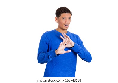 Closeup portrait of a handsome young man looking shocked, surprised in disbelief with arms palms in the air pushing away, isolated on white background. Negative human emotions facial expressions