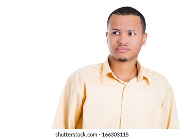 Closeup portrait of a handsome young man looking away shocked, surprised in disbelief, isolated on white background with space to left. Negative human emotions facial expressions