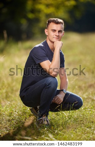 Similar – Image, Stock Photo Stylish teenager sitting on a wooden bench