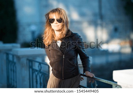 Similar – Portrait von einer jungen Frau mit Wind im Haar