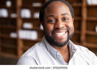 Close-up Portrait Of A Happy African-American Young Man With Friendly Wide Toothy Smile, A Mixed-race Bearded Guy Wearing Shirt Looks Into Camera, Employee Profile Photo