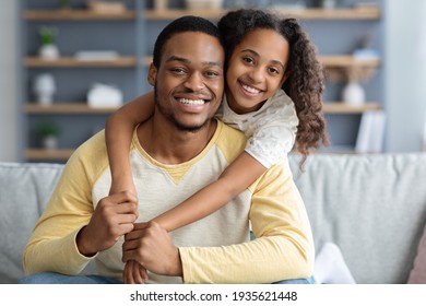 Closeup Portrait Of Happy Black Father And Daughter Embracing