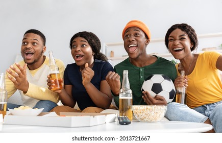 Closeup Portrait Of Happy Black Friends Football Fans Watching Game At Home, Gesturing And Screaming. Emotional African American Men And Women With Soccer Ball Enjoying Football Game, Panorama