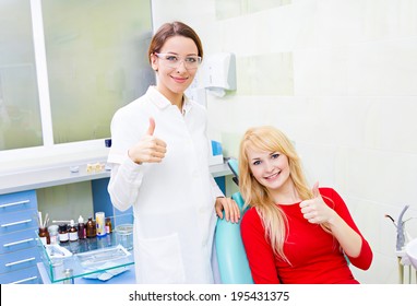 Closeup Portrait Happy Female Health Care Professional Dentist, Satisfied Smiling Woman Patient In Office Giving Thumbs Up Sign Gesture. Successful Treatment Procedure, Care, Outcome. Positive Emotion