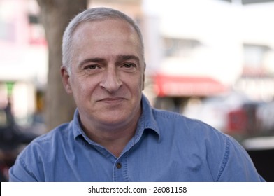 Close-up Portrait Of A Happy Mature Man, Shallow Depth Of Field