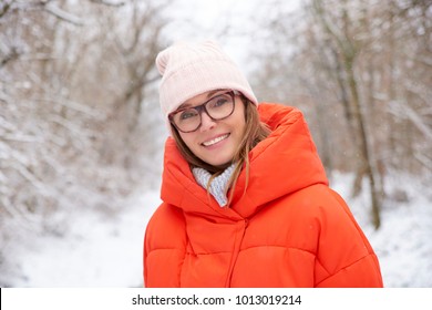 Close-up Portrait Of Happy Mature Woman Standing Outside At Snowy Landscape And Enjoy Winter Season. 