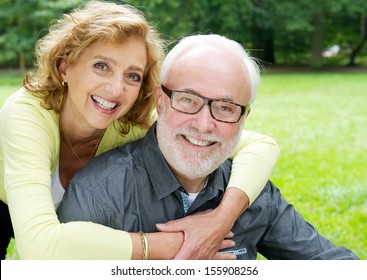 Closeup Portrait Of A Happy Older Couple Smiling  And Showing Affection