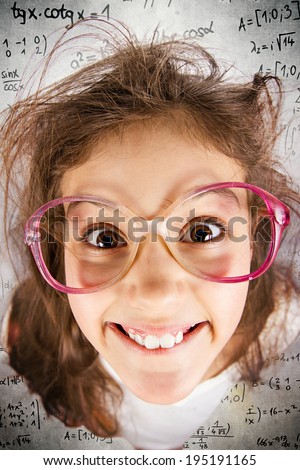 Closeup portrait happy, smiling , excited, funny looking, little girl with big glasses, messy hair, background with math formulas. Positive human emotions, facial expressions, attitude, reaction
