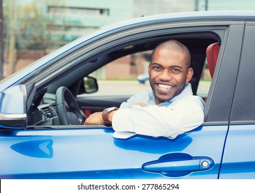 Closeup Portrait Happy Smiling Young Man Buyer Sitting In His New Car Excited Ready For Trip Isolated Outside Dealer Dealership Lot Office. Personal Transportation Auto Purchase Concept