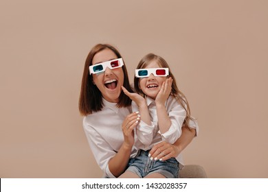 Close-up Portrait Of Happy Woman With Little Girl Watching A Movie In 3D Glasses With Surprised Emotions