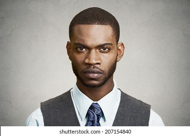 Closeup Portrait, Headshot Handsome Serious Corporate Business Man Looking At You Gesture Skeptically, Isolated Black Background. Negative Human Emotions, Facial Expression, Feeling, Body Language