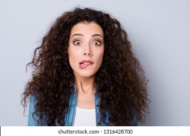 Close-up portrait of her she nice cute charming attractive lovely unsure puzzled shocked wavy-haired girl worrying biting lip isolated over gray pastel background
