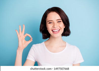 Close-up portrait of her she nice attractive lovely cheerful cheery girl showing ok-sign ad solution good choice isolated on bright vivid shine vibrant blue turquoise color background