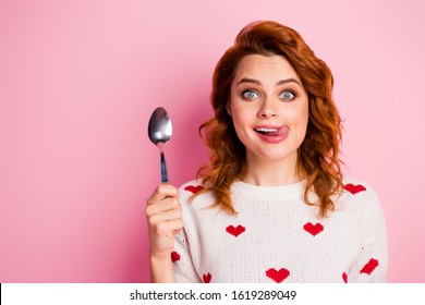 Close-up portrait of her she nice attractive lovely funky comic cheerful cheery wavy-haired girl licking lip want wish tasty yummy delicious festal meal isolated on pink pastel color background
