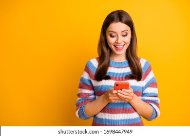 Close-up portrait of her she nice attractive lovely glad cheerful cheery brown-haired girl holding in hands cell chatting with boyfriend isolated on bright vivid shine vibrant yellow color background - Shutterstock ID 1698447949