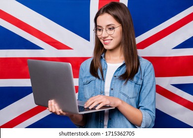 Close-up portrait of her she nice attractive intelligent cheerful focused girl working on laptop creating report essay article test pass isolated over british stripes flag background - Shutterstock ID 1715362705