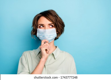 Close-up portrait of her she nice pretty pensive lady wearing gauze mask creating strategy stop contamination personal protect isolated bright vivid shine vibrant blue color background - Powered by Shutterstock