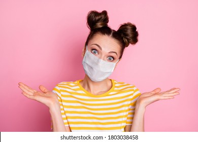 Close-up portrait of her she nice attractive puzzled confused indifferent girl wearing safety mask shrugging shoulders mers cov pandemia disease risk isolated pastel pink color background