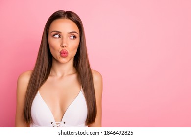 Close-up portrait of her she nice attractive lovely charming winsome pretty adorable gorgeous straight-haired lady sending kiss looking aside copy space isolated over pink pastel background
