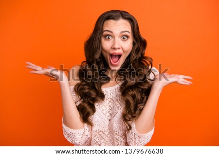 Close-up portrait of her she nice adorable winsome attractive lovely charming cute cheerful cheery wavy-haired lady isolated over bright vivid shine orange background