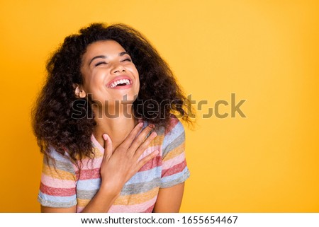 Close-up portrait of her she nice attractive cheerful cheery delighted wavy-haired girl wearing striped tshirt laughing out loud isolated over bright vivid shine vibrant yellow color background