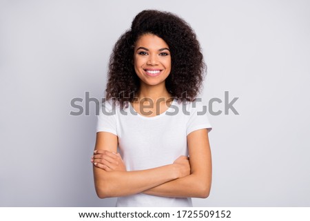 Close-up portrait of her she nice attractive lovely pretty cheerful cheery glad wavy-haired girl folded arms isolated over light white pastel color background