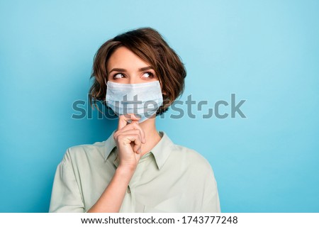 Close-up portrait of her she nice pretty pensive lady wearing gauze mask creating strategy stop contamination personal protect isolated bright vivid shine vibrant blue color background