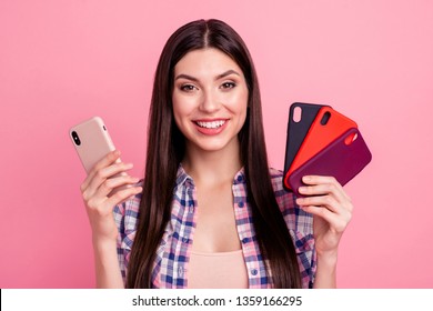 Close-up portrait of her she nice-looking attractive cute charming shine lovely cheerful straight-haired lady holding in hands cool cases new cell isolated over pink pastel background