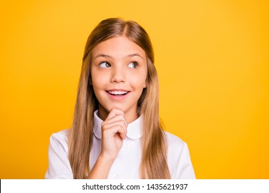 Close-up portrait of her she nice-looking attractive winsome creative genius brainy pretty cheerful cheery straight-haired pre-teen girl touching chin isolated on bright vivid shine yellow background