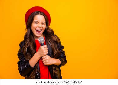 Close-up portrait of her she nice-looking attractive charming trendy fashionable cheerful wavy-haired girl singing karaoke hit isolated over bright vivid shine vibrant yellow color background