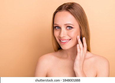 Close-up portrait of her she nice-looking attractive cheerful straight-haired girl applying moisturizing nourishing effective cream pure smooth soft clean clear skin isolated over beige background