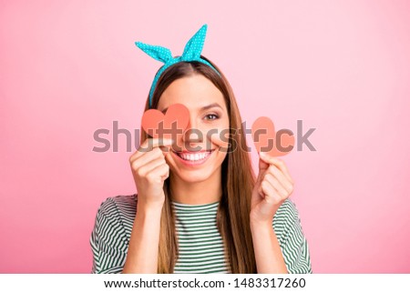 Close-up portrait of her she nice-looking attractive lovely lovable winsome charming cheerful cheery straight-haired girl holding in hands small hearts isolated over pink pastel background