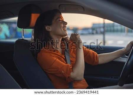 Close-up portrait of her she nice-looking attractive lovely brunette charming glad cheerful cheery girl riding new car enjoying having fun listening music singing pop rock