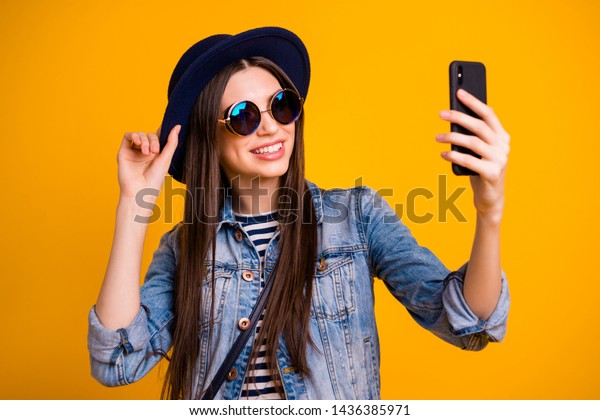 Close-up portrait of her she nice-looking charming attractive lovely winsome fascinating cheerful cheery straight-haired lady making taking selfie isolated over bright vivid shine yellow background