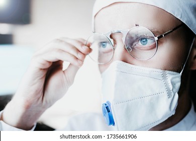 Closeup Portrait Of A Heroic Dramatic Doctor In Masked Glasses And Uniform.