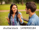 Close-up portrait of his he her she nice attractive lovely charming cute cheerful cheery friends wearing denim girl telling sharing news story spending free time in green wood forest outdoors