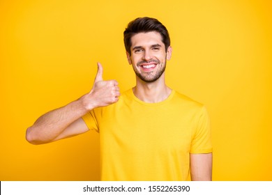 Close-up Portrait Of His He Nice Attractive Cheerful Cheery Guy Wearing Tshirt Showing Thumbup Ad Advert Solution Isolated Over Bright Vivid Shine Vibrant Yellow Color Background