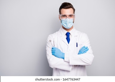 Close-up Portrait Of His He Nice Attractive Cheerful Experienced Doc Dentist Holding In Hands Steel Tools Dental Procedure Center Isolated On Light White Gray Pastel Color Background