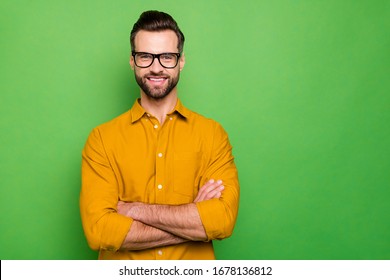 Close-up portrait of his he nice attractive cheerful cheery bearded guy in casual formal shirt office employee folded arms isolated on bright vivid shine vibrant green color background