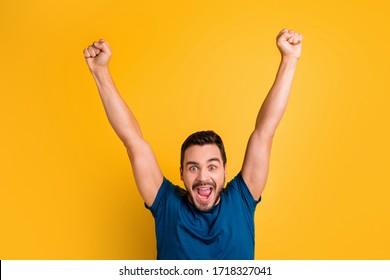Close-up portrait of his he nice attractive glad overjoyed cheerful cheery guy celebrating raising hands up having fun isolated over bright vivid shine vibrant yellow color background - Shutterstock ID 1718327041