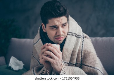 Close-up Portrait Of His He Nice Attractive Sad Sick Miserable Guy Sitting On Divan Drinking Hot Green Herbal Tea Beverage Weakened Immunity Leave At Modern Industrial Loft Concrete Interior Style