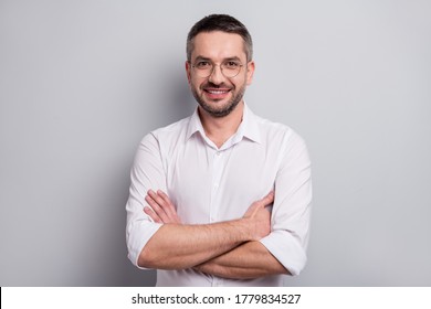 Close-up portrait of his he nice attractive cheerful cheery content mature man skilled it specialist lawyer attorney wearing specs folded arms isolated over light gray pastel color background - Shutterstock ID 1779834527