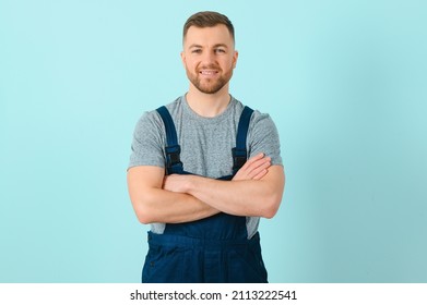 Close-up portrait of his he nice attractive cheerful cheery content guy repairer craftsman isolated over blue color background.