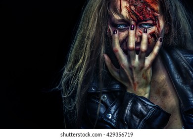 Close-up portrait of horrible zombie woman. Horror. Halloween