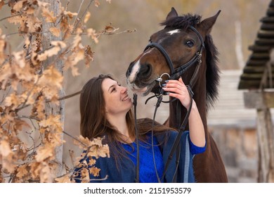 Close-up Portrait Of A Horse And A Beautiful Girl Of Slavic Appearance