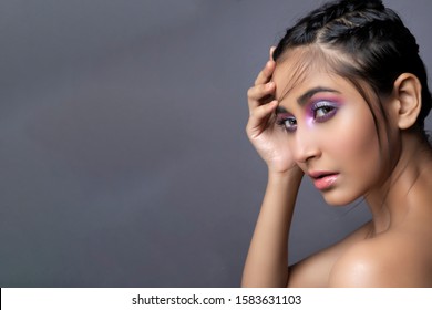 Closeup Portrait Of An Indian Model With Bold Eye Makeup And Lipstick Looking At Camera. Makeup Portrait For Eye Makeup And Lipstick.