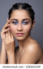 Closeup Portrait Of An Indian Model With Bold Eye Makeup And Lipstick Looking At Camera. Makeup Portrait For Eye Makeup And Lipstick.