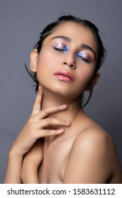 Closeup Portrait Of An Indian Model With Bold Eye Makeup And Lipstick Looking At Camera. Makeup Portrait For Eye Makeup And Lipstick.